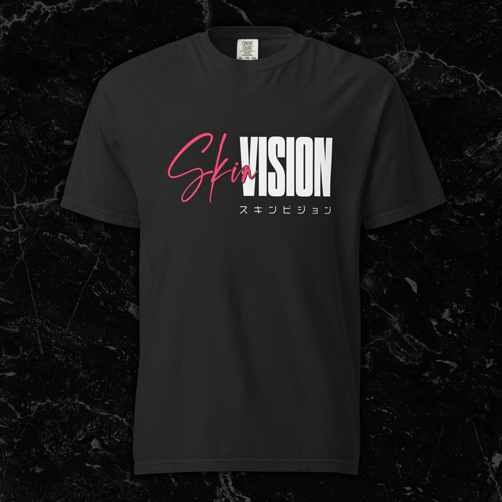 Black t-shirt featuring the SkinVision logo in white block and pink script lettering with Japanese katakana text underneath by SkinVision