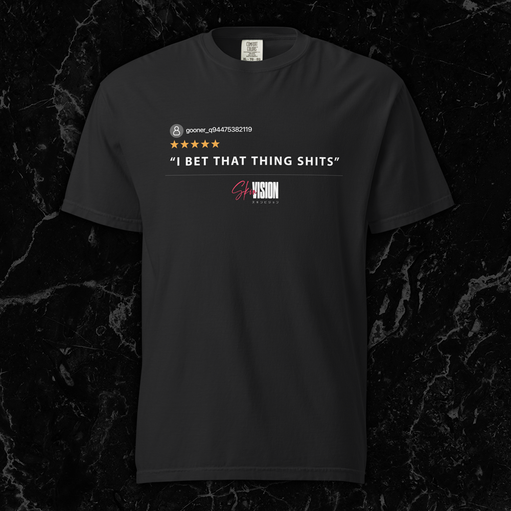 Black t-shirt featuring a five-star review with the quote 'I Bet That Thing Shits' and SkinVision branding by SkinVision